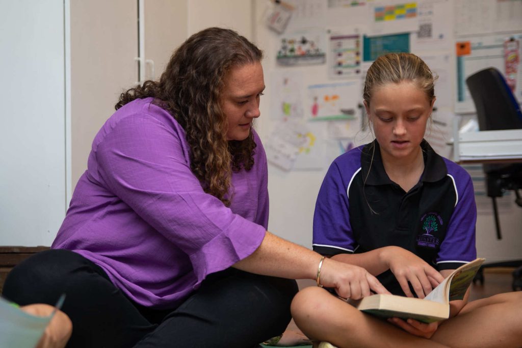 Teacher instructing a student at Leinster Community School